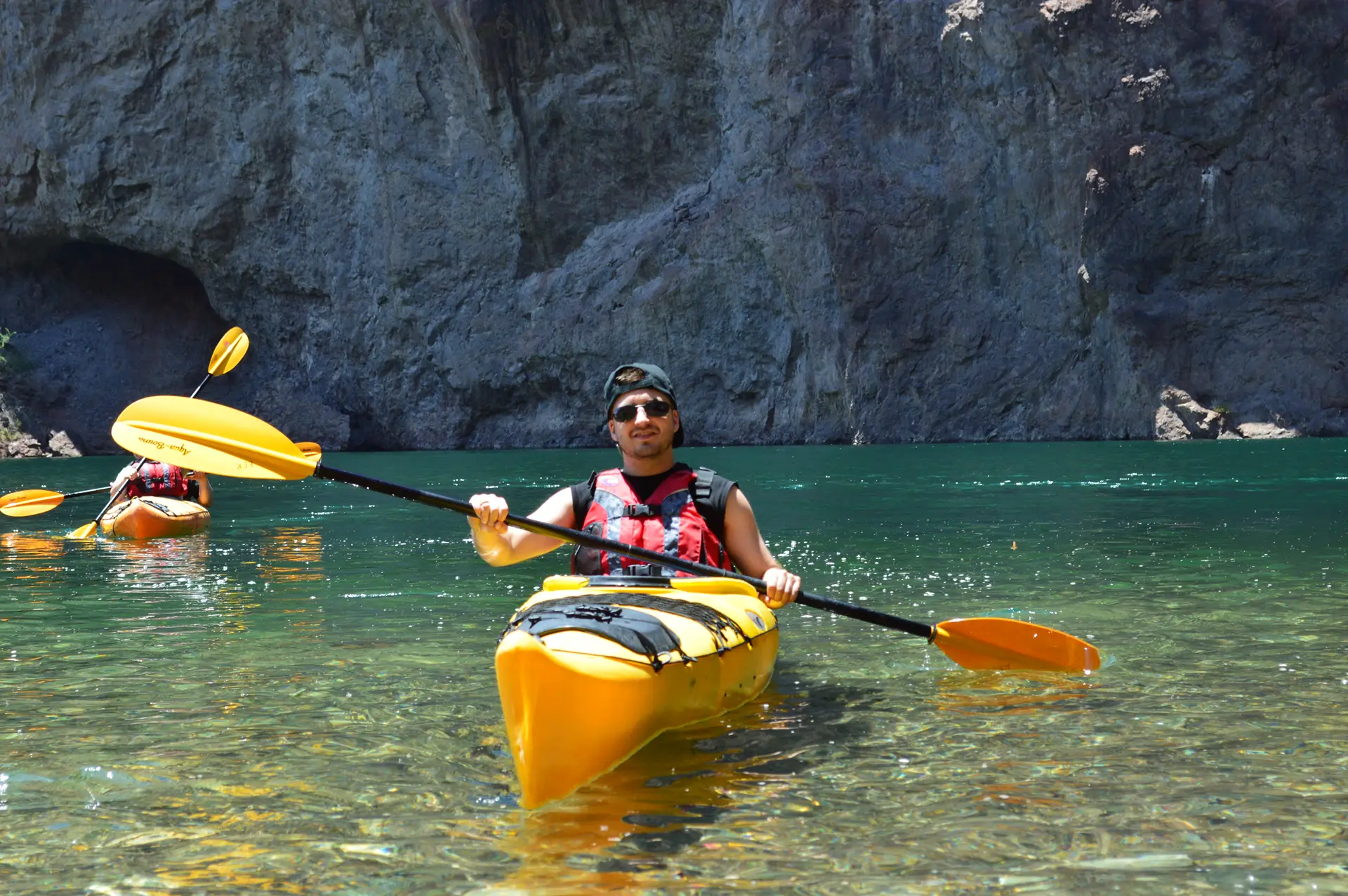Kayaker paddling the clear waters of the Colorado River