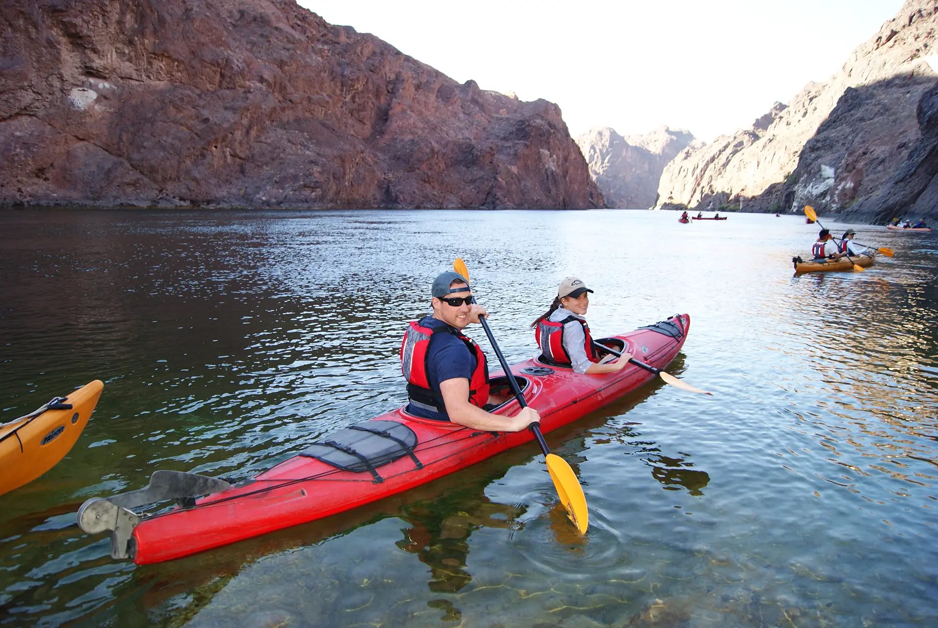 Guided group kayaking through the canyon toward Hoover Dam